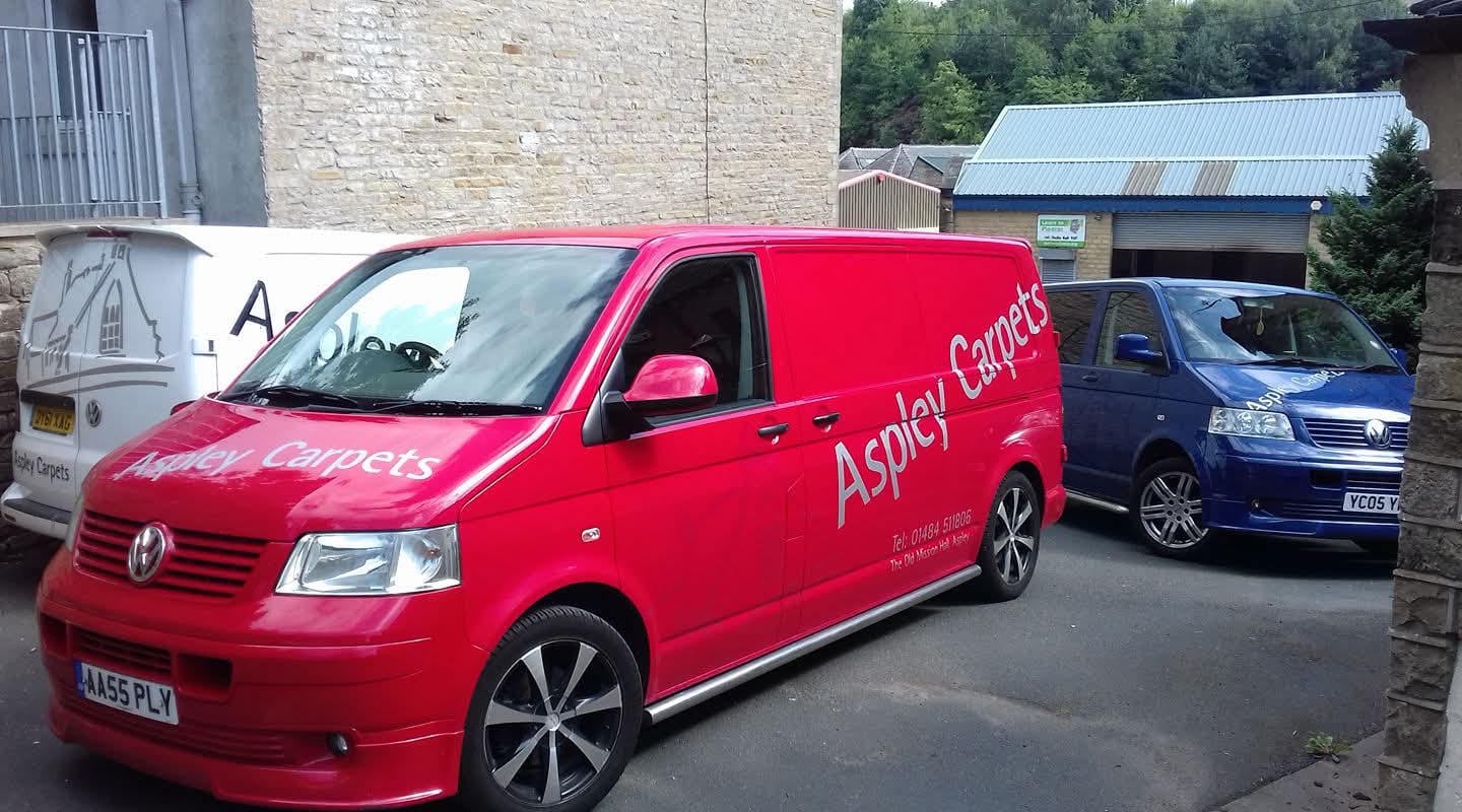 The Aspley Carpets van, parked alongside two other vans